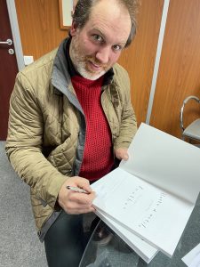 François Pernel signing his book, at the Camac offices