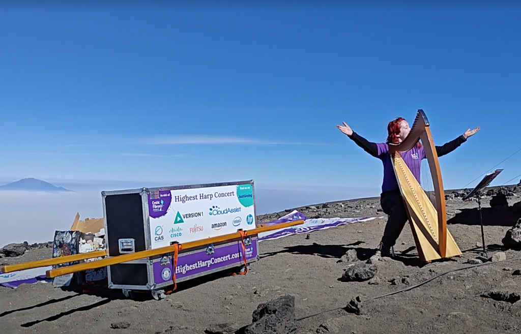 Siobhan Brady, understandably exultant, as she prepares to play at the summit of Kilimanjaro.