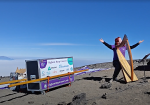 Siobhan Brady, understandably exultant, as she prepares to play at the summit of Kilimanjaro.