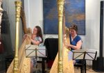 Anneleen and Petra trying out harps at the Camac Nederlands showroom.